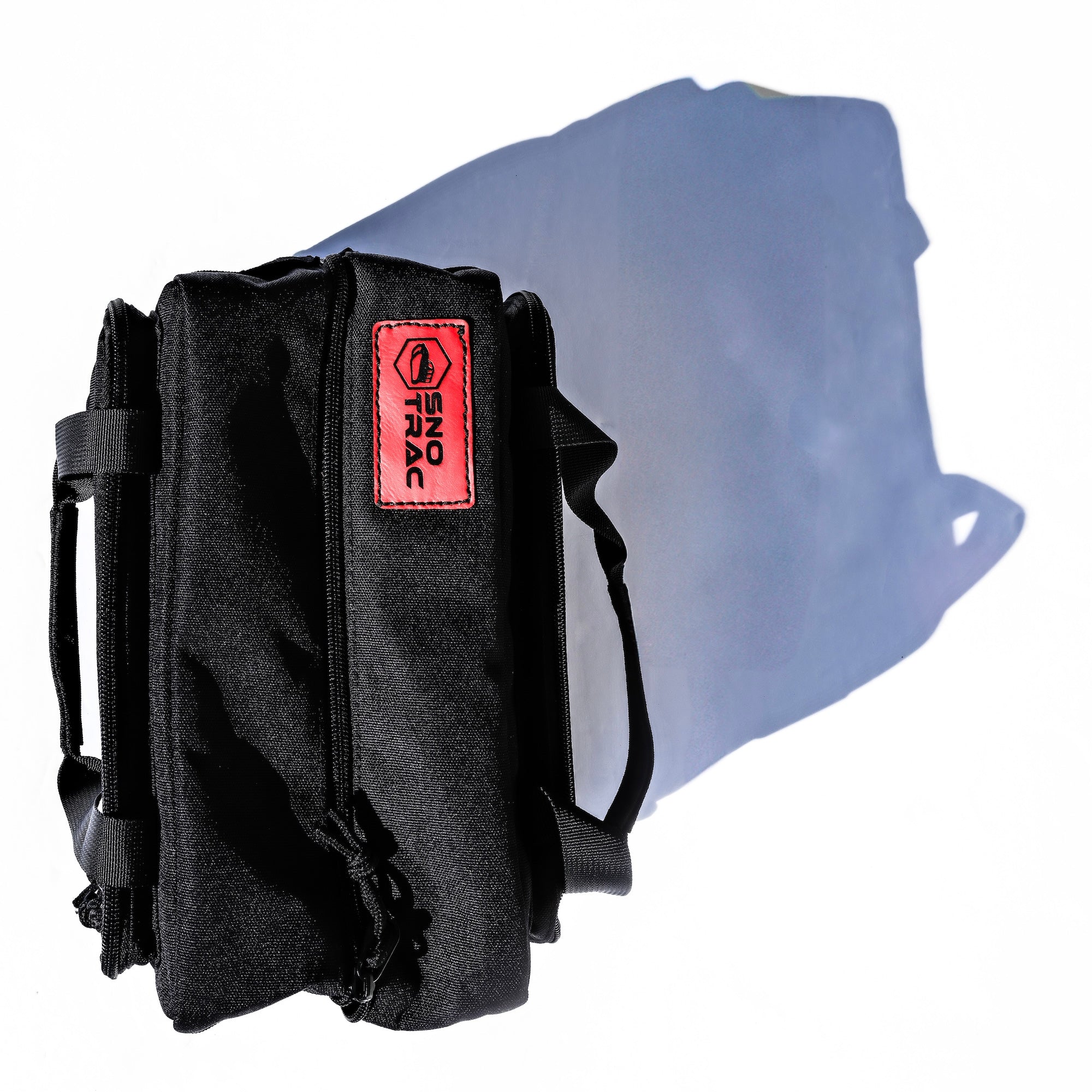 Black field toolkit bag with a Sno Trac label