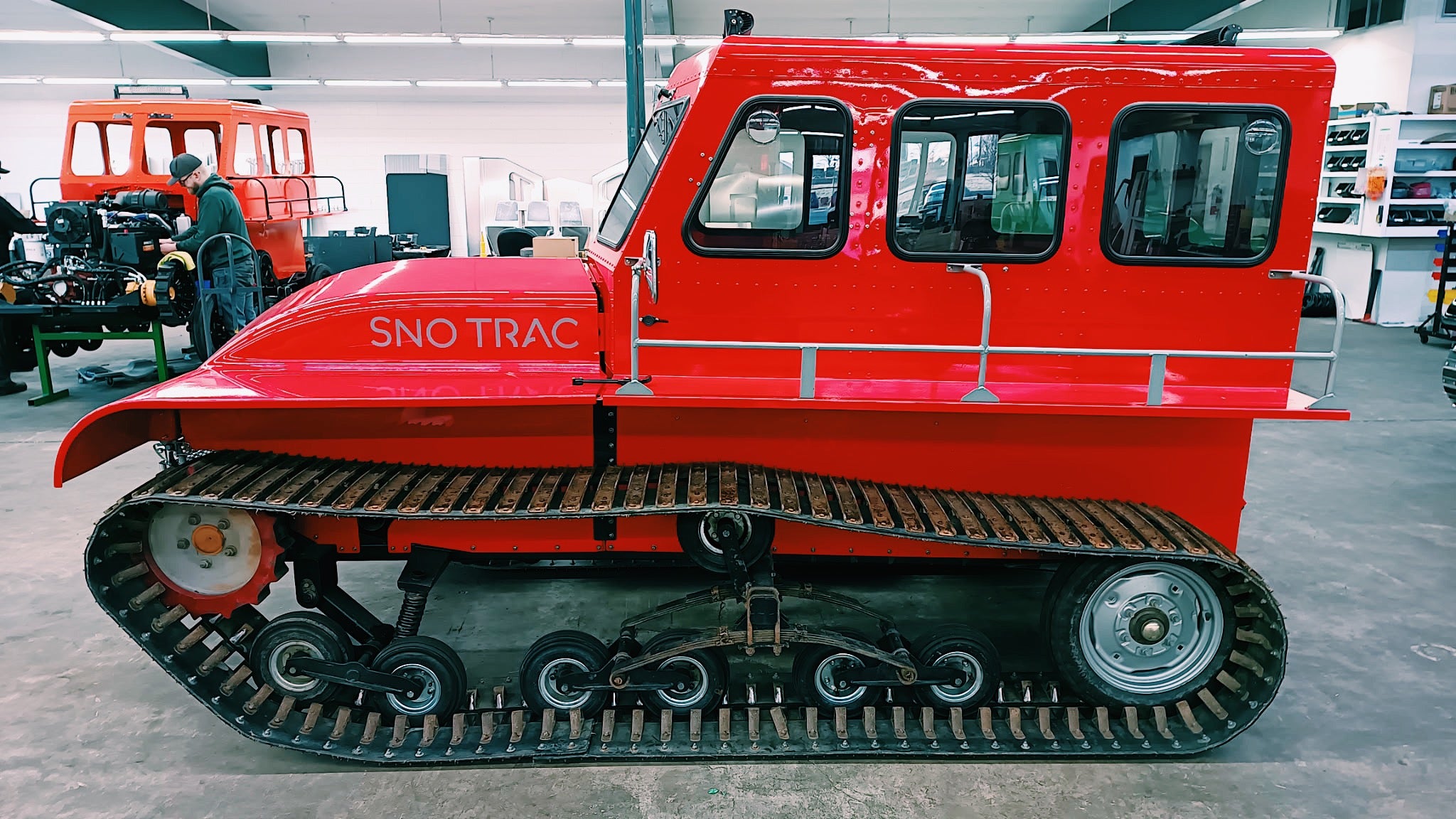 Red Sno Trac vehicle in a warehouse
