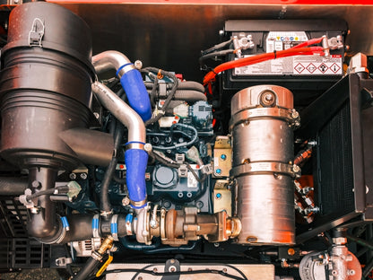 Close-up of a Sno Trac engine with various components