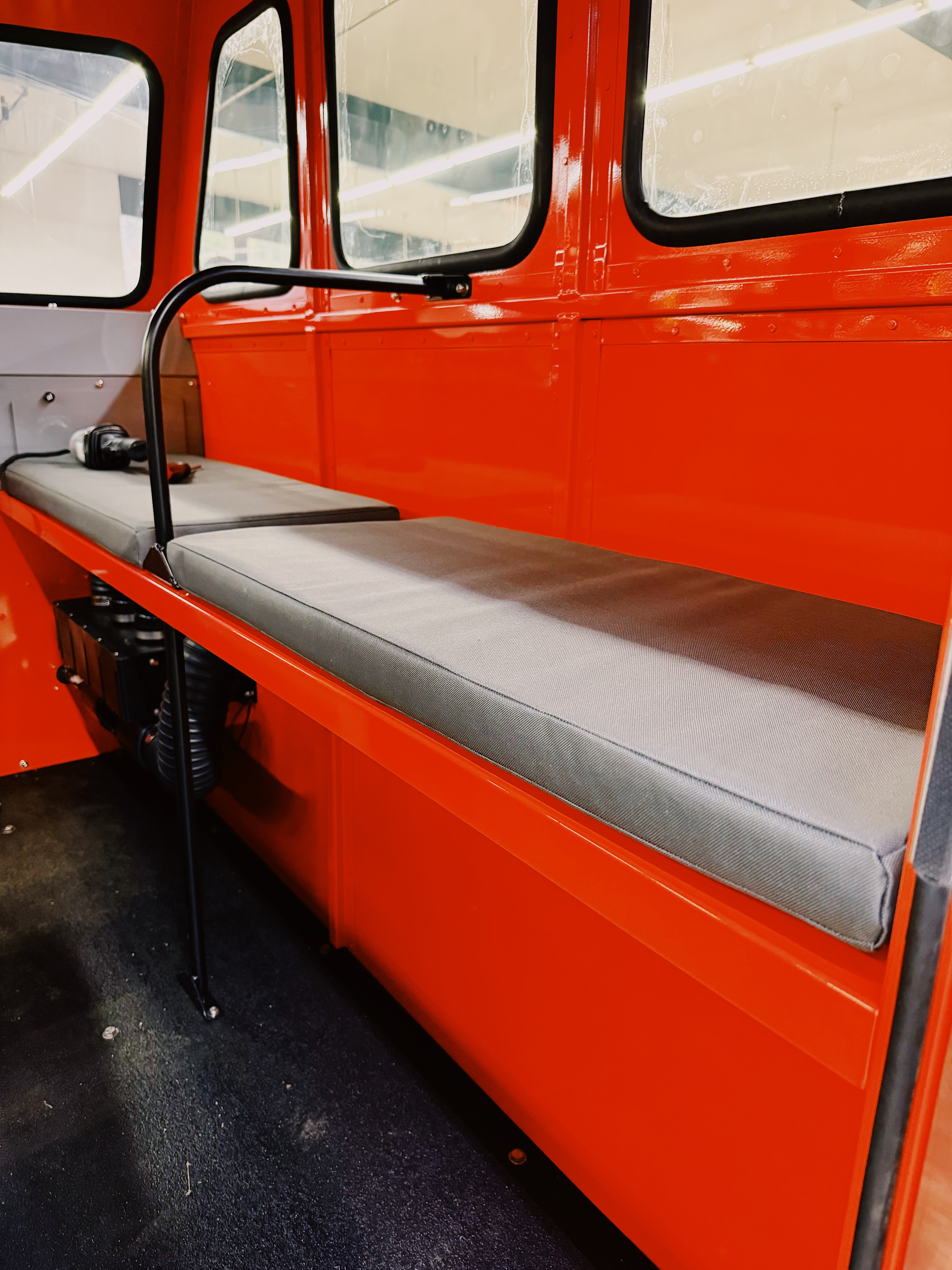 Orange Sno Trac with seating for seven passengers