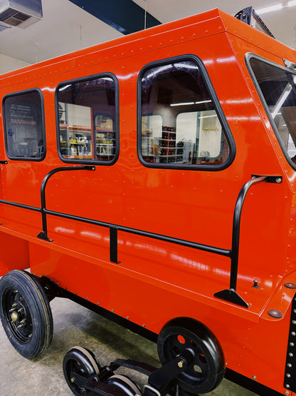 Sno Trac features storage racks on exterior for gear including snow boards and bags