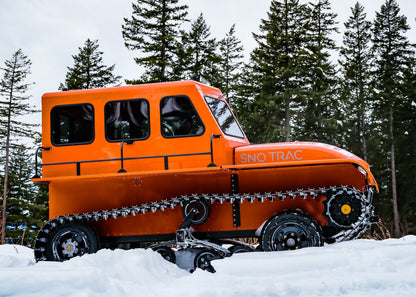 Profile of Orange Sno Trac built for snow adventure.