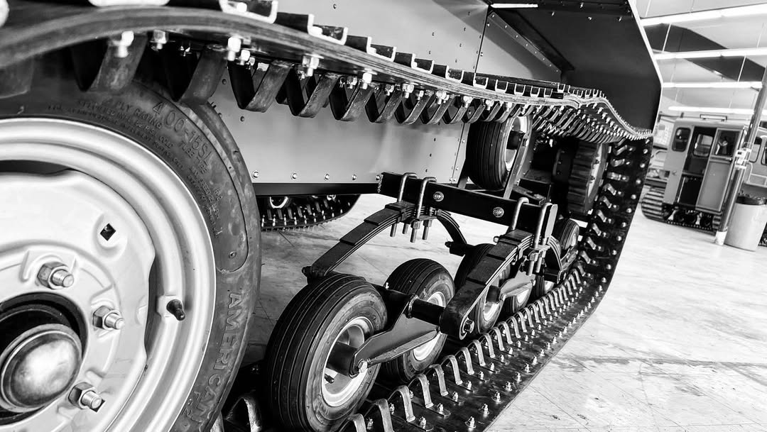 Close-up of a Sno Trac's tracks and wheel system.