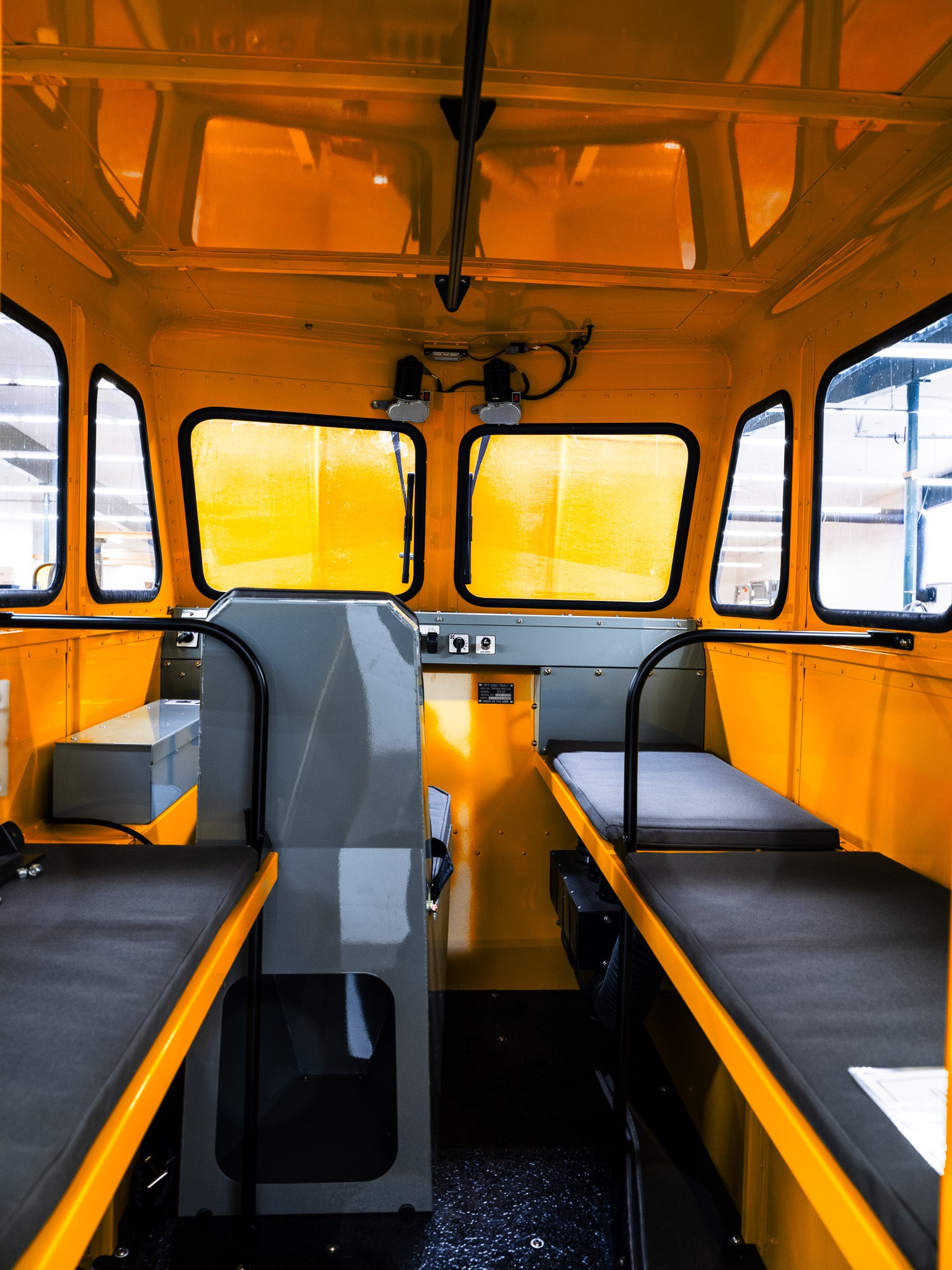 Interior of a yellow Sno Trac with room for seven passengers